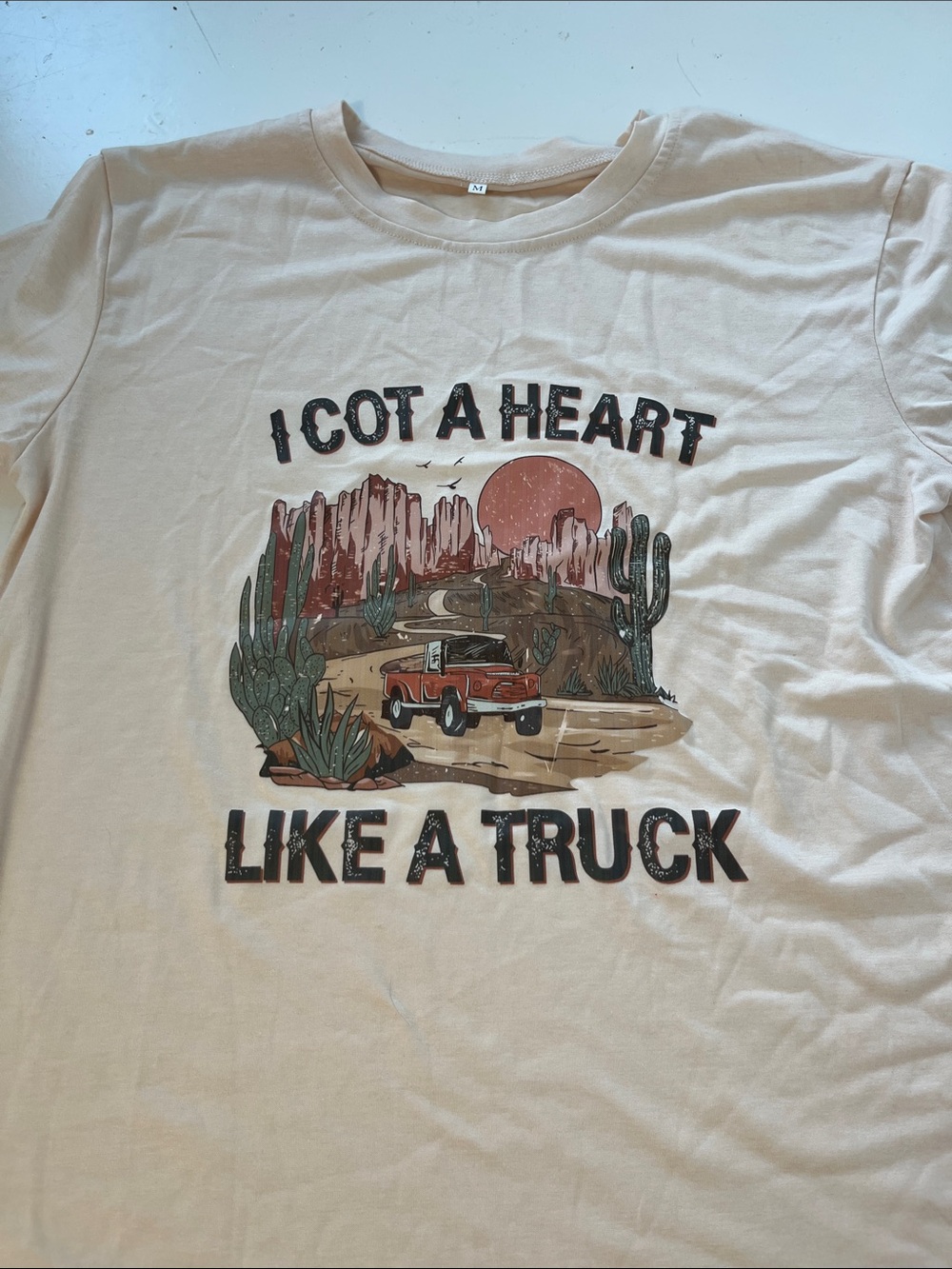 Amazon Medium I Got A Heart Like A Truck Short Sleeve Beige Graphic T Shirt - Picture 4 of 6